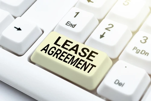 Close-up of a keyboard with a key labeled 'Lease Agreement' in place of a regular key.
