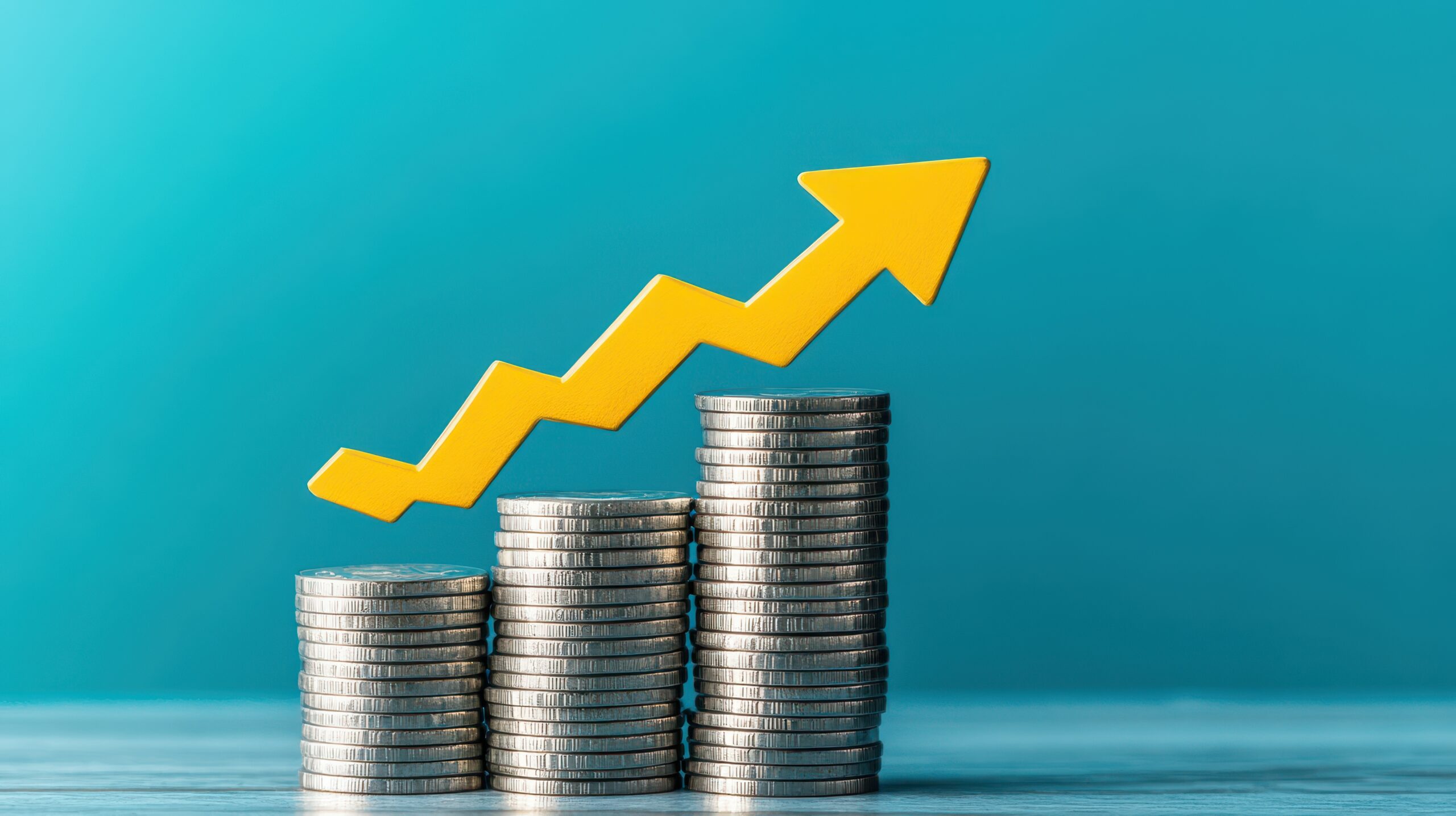 Blue Upward arrow on money coin stack, representing growth or rent raises.
