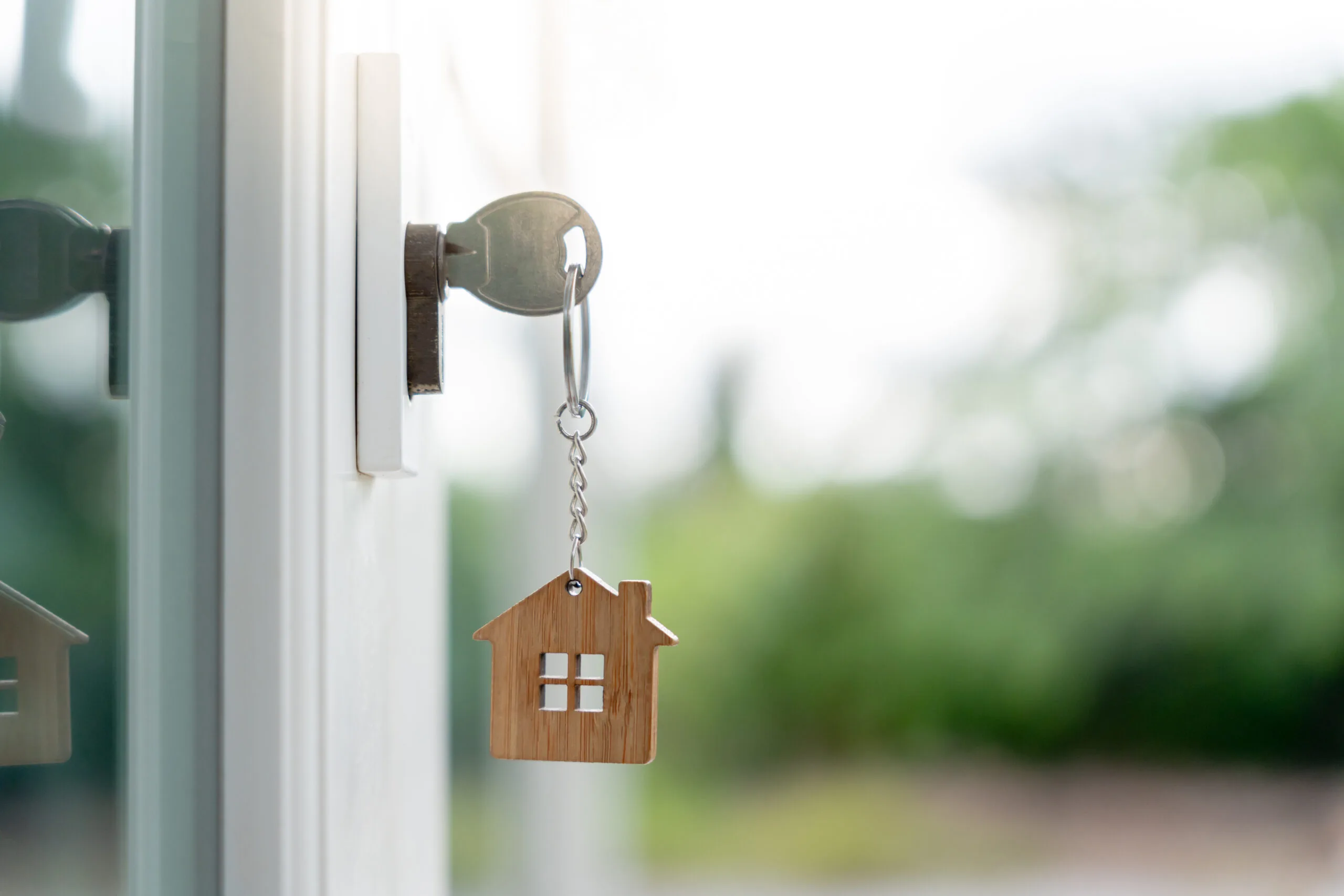 Landlord key for unlocking house is plugged into the door.