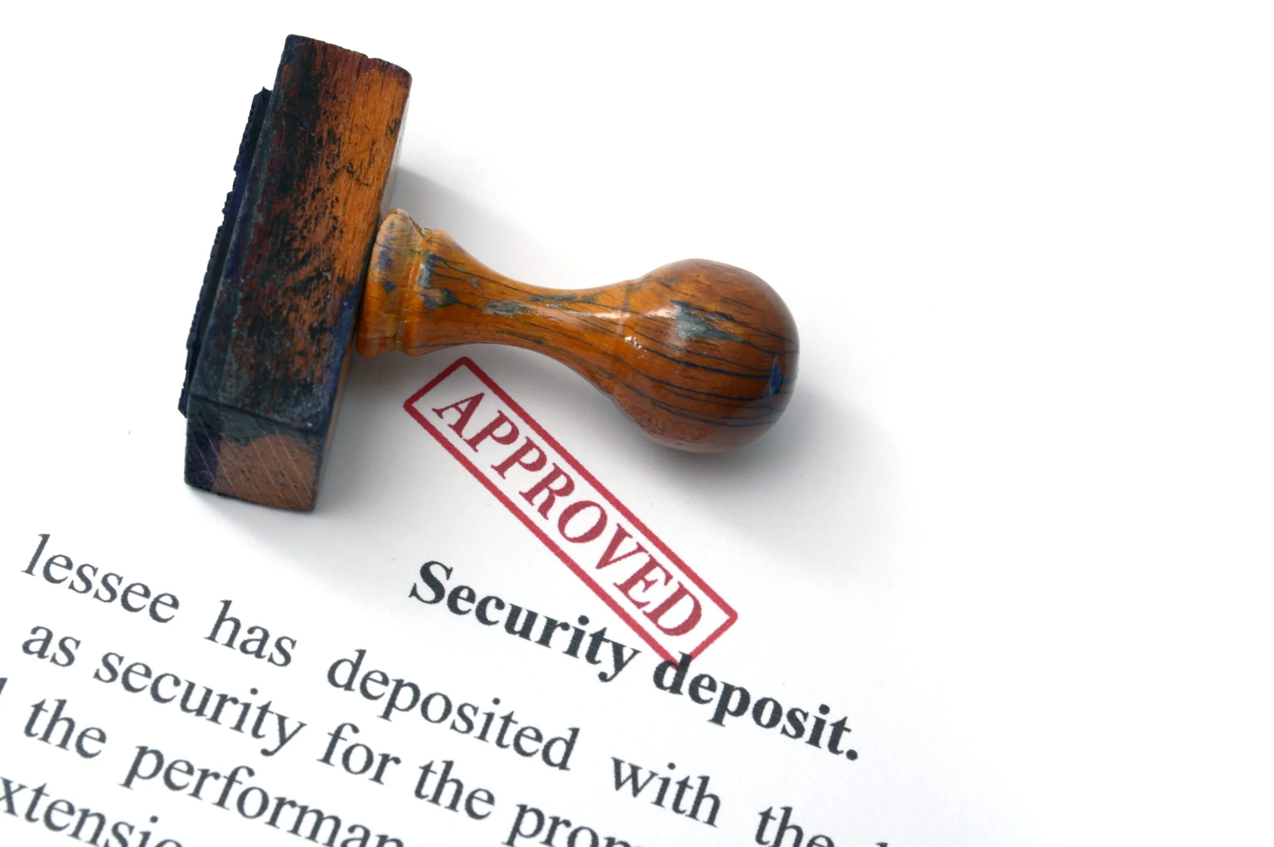 A security deposit with an "approved" stamp on it