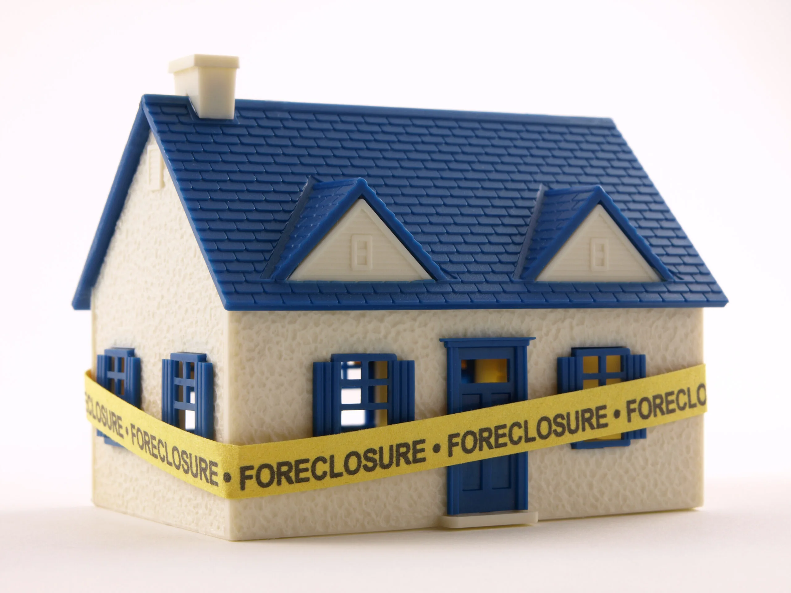 House wrapped with Foreclosure tape 