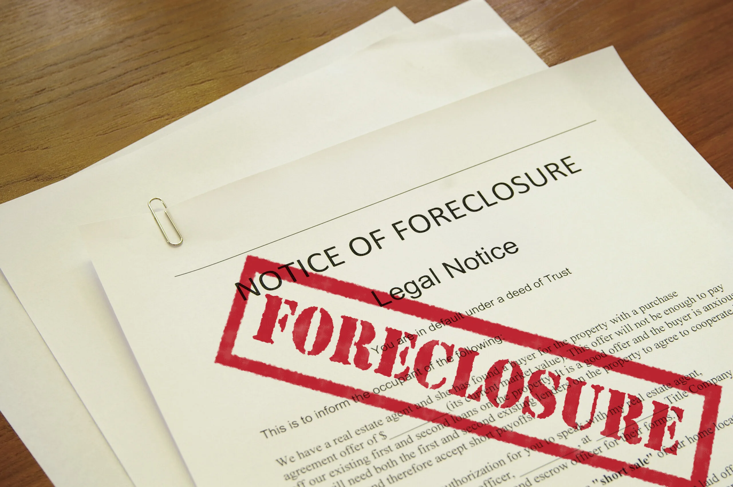 mortgage foreclosure document with red stamped text for can a landlord collect rent if the property is in foreclosure article