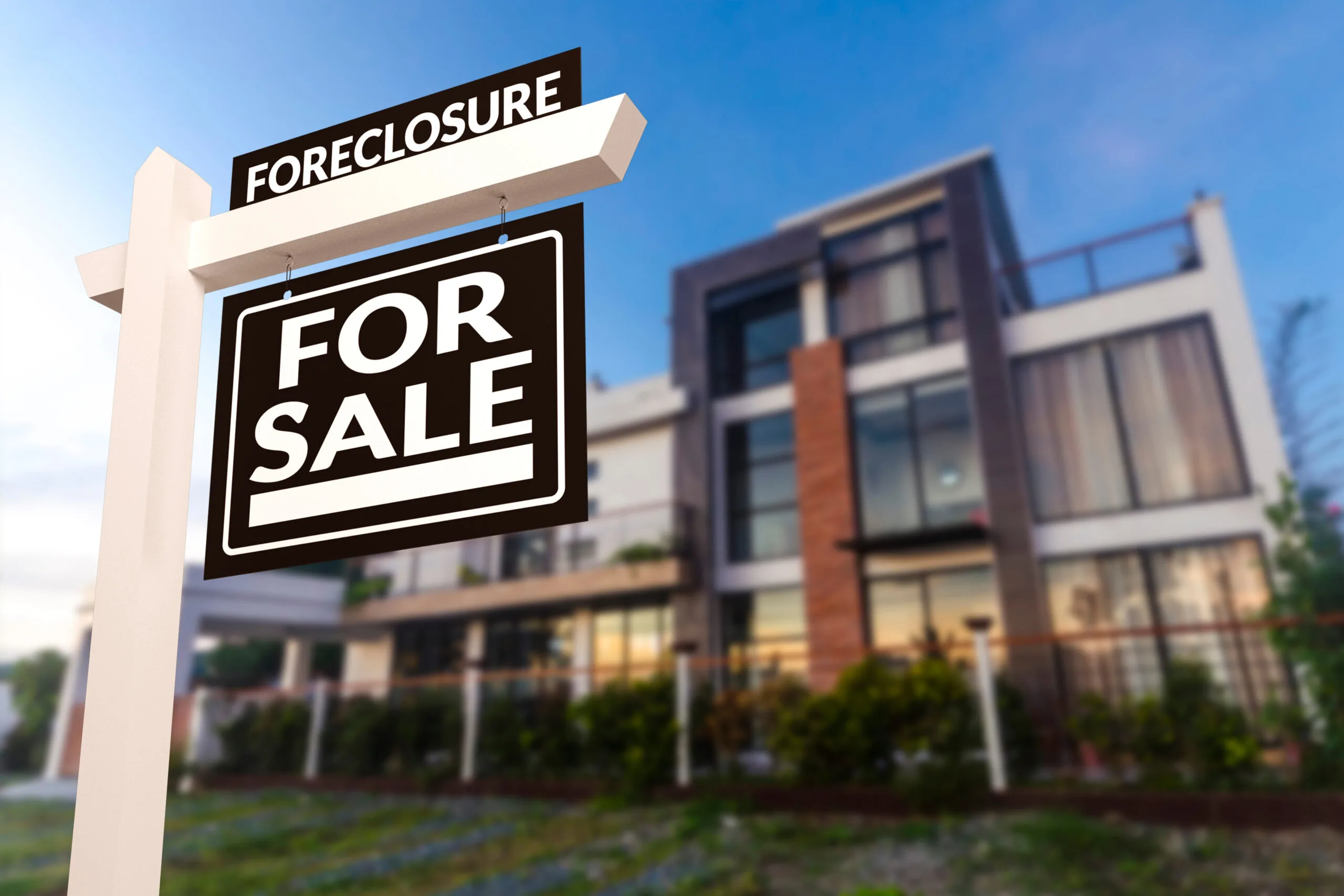 "foreclosure for sale" sign in front of apartments