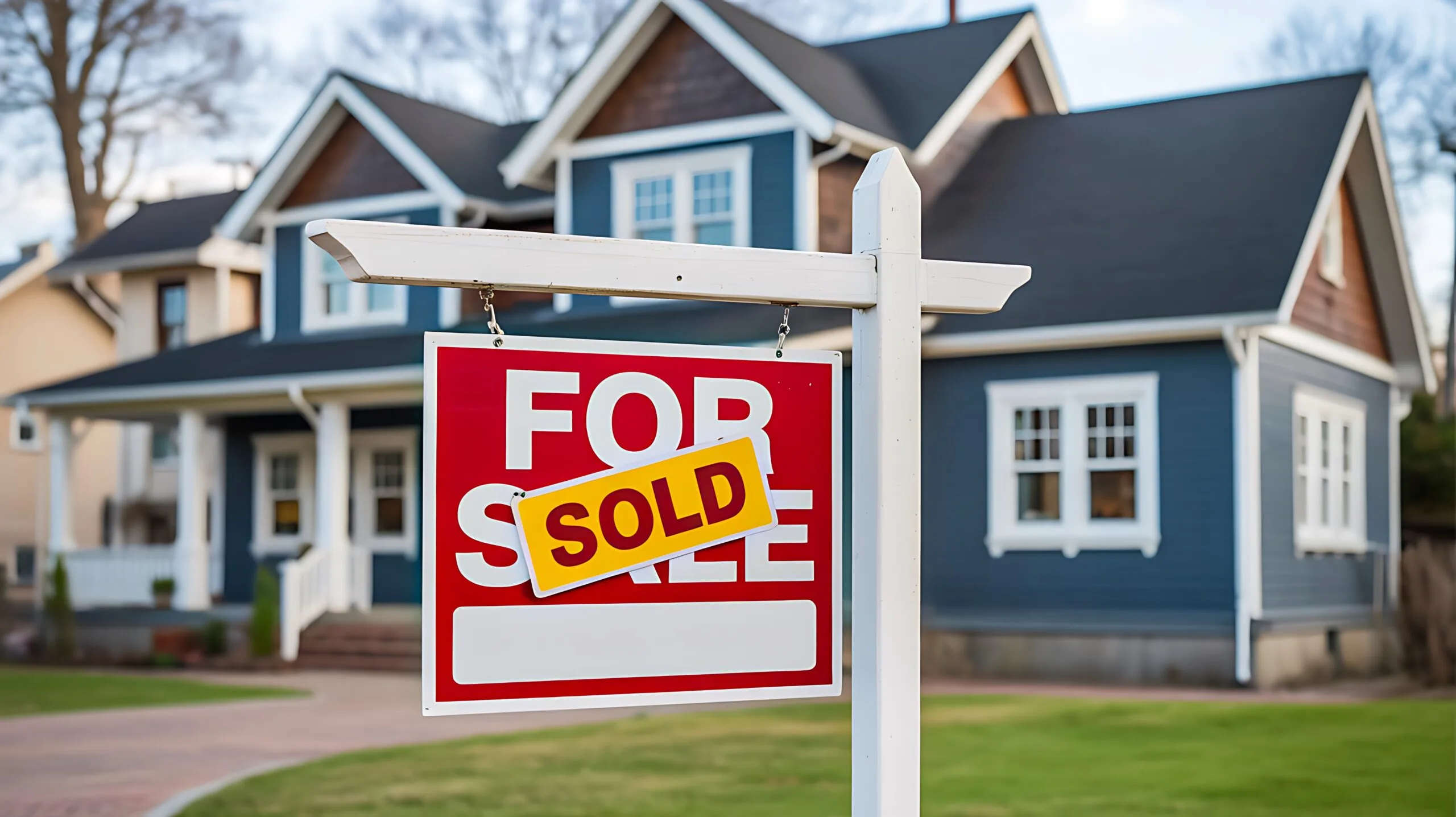 sold sign in front of house