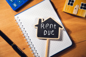 rent due sign on chalkboard