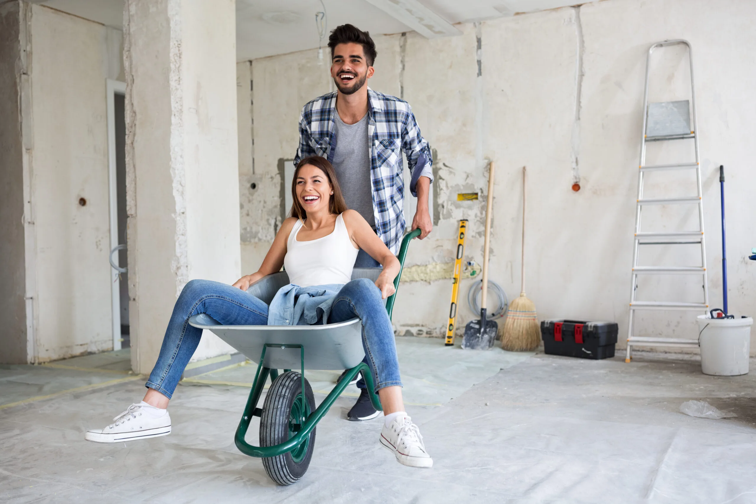 couple having fun renovating a home