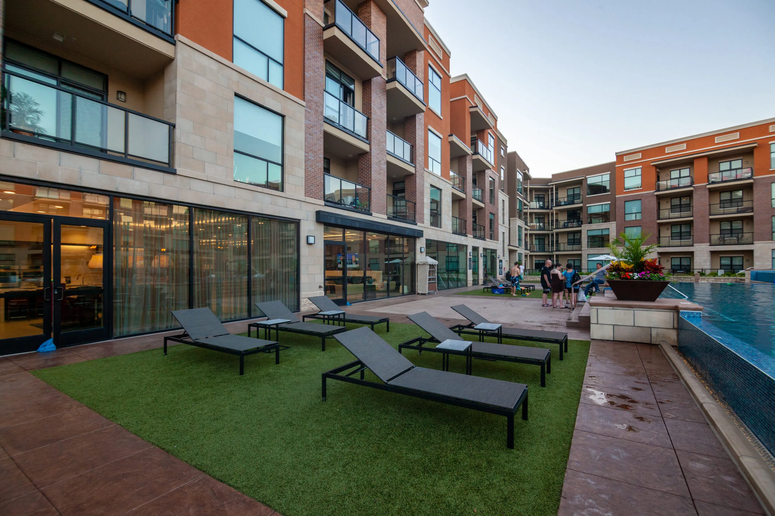 co-living apartments with lounge chairs outside