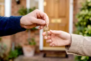 landlord giving keys to tenant
