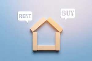 Can You Own a House and Rent Another? renting or buying real estate house made of wooden blocks with icons