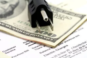 power cord and us dollar, concept of expensive energy bill, average electric bill in Austin