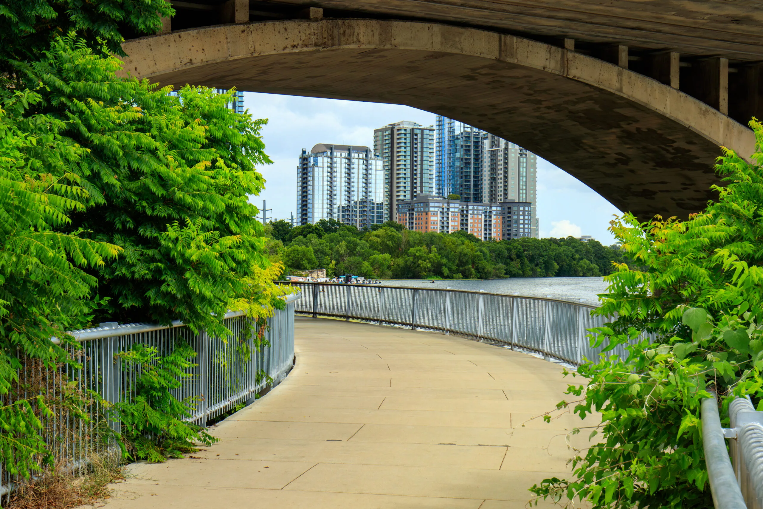 Pedestrian walkway under the South Congress bridge along Lady Bird Lake Austin Texas | Bay Management Group Texas